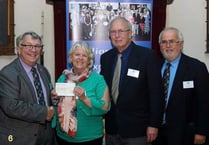 QE School presented with £1,000 cheque from Mason's WAKE Fund