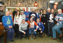Staff wore Christmas jumpers to raise £500 for charity