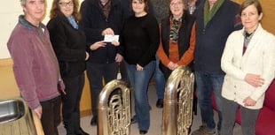 Crediton Town Band presents £318 each to Age Concern Crediton and Mid Devon Mobility