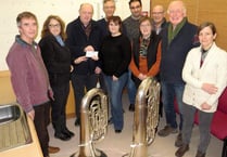 Crediton Town Band presents £318 each to Age Concern Crediton and Mid Devon Mobility