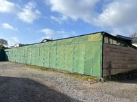 Questions over plan for five homes on site of 24 garages in Crediton
