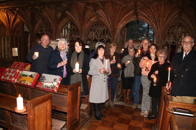 A candlelit service, including prayers for peace in Ukraine, was held at Coldridge Parish Church on Sunday, February 27. Pictured are some of those who attended the service. AQ 5354