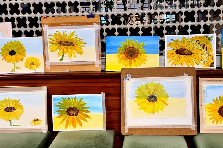 The sunflowers painted by members of Crediton Bowls Art Group.