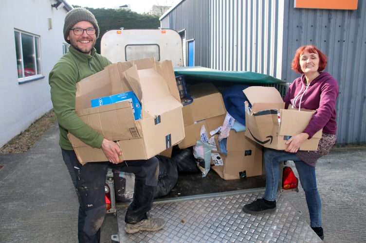 Mike Krefta and Bindy Saywood unloading items for sorting for Ukraine at The White Room in Crediton.  AQ 5514
