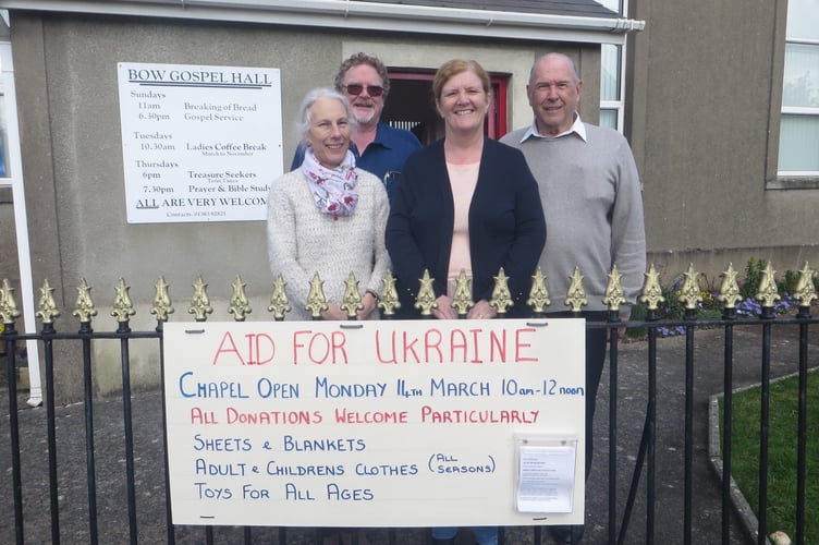 Outside Bow Gospel Hall with the sign are Ian and Jayne Finch and Ken and Wendy Harris. SR 1324