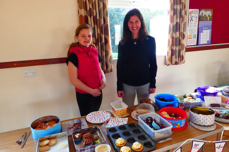 Debbie Jones with a young helper at the Help for Heroes event at Cheriton Fitzpaine. Photo: David Nunn