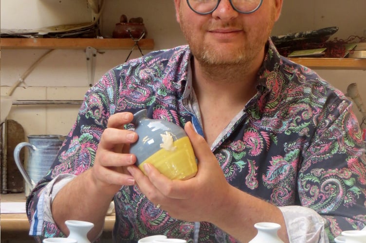Ross Marshall holding one of his pots for Ukraine.  SR 1468
                               