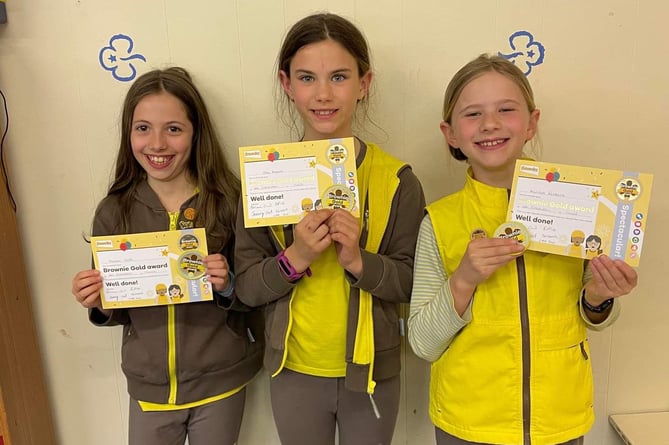 Three of the five members of the 4th Crediton Brownies who have completed their Gold Awards, the highest award that can be achieved as Brownies.
