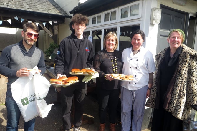 Sarah Parkinson of The Duck (centre) with staff and customers for the bacon baps and burgers coming out of the kitchen.  SR 1494
