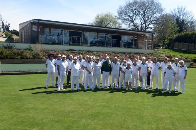 Members gather on the green with the clubhouse behind them at the opening of North Tawton Bowling Club.  SR 1571
