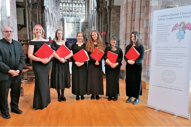 Stephen Tanner with Isca Voices - former Girl Choristers from Exeter Cathedral.  Standing next to him is local girl, now an elegant young lady, Ottilie Hankin who used to sing with the Church Choir.
