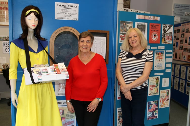 Crediton Museum 1950’s Exhibition curators Cheryl Lewis and Mavis Monaghan with the usherette beside the Palace Cinema display. AQ 5984
