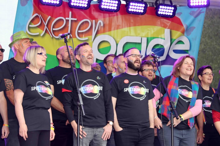 Spectrum Choir on the stage at Exeter Pride in 2019.  AQ 1055