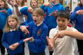 Children at Cheriton Fitzpaine School learning sign language 