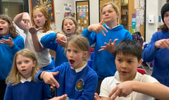 Children at Cheriton Fitzpaine School learning sign language 