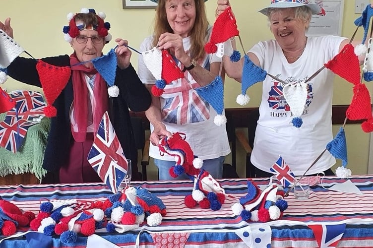Holding up their bunting, left to right, Dot, Sue Frankham and Terri Saffin. 