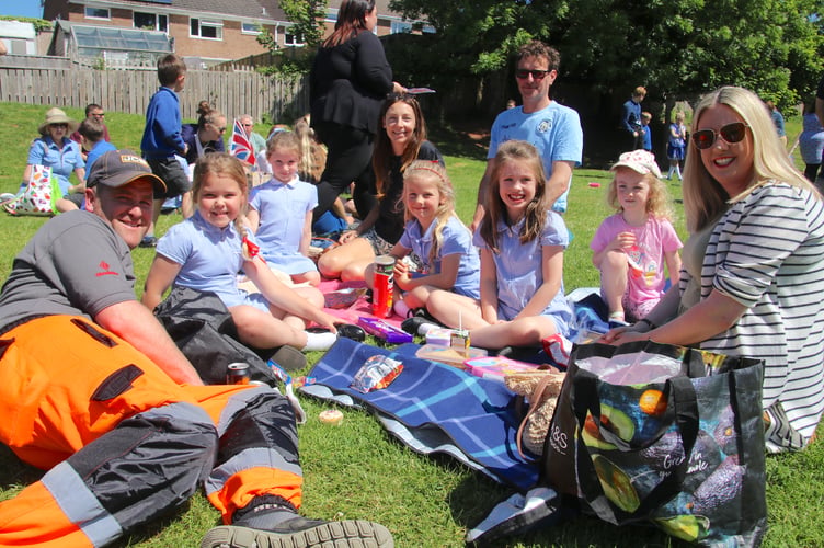 Children and families enjoying their picnics at Landscore Primary School. AQ 6464