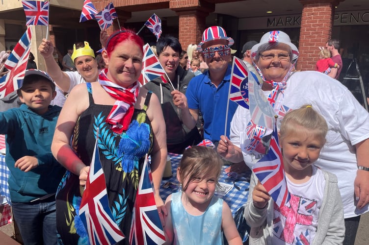 Crediton residents with their flags at the Exeter Street party. AQ 8760