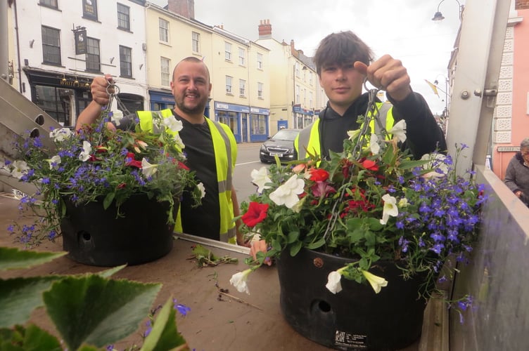 Up go the hanging baskets in Crediton High Street. SR 2256