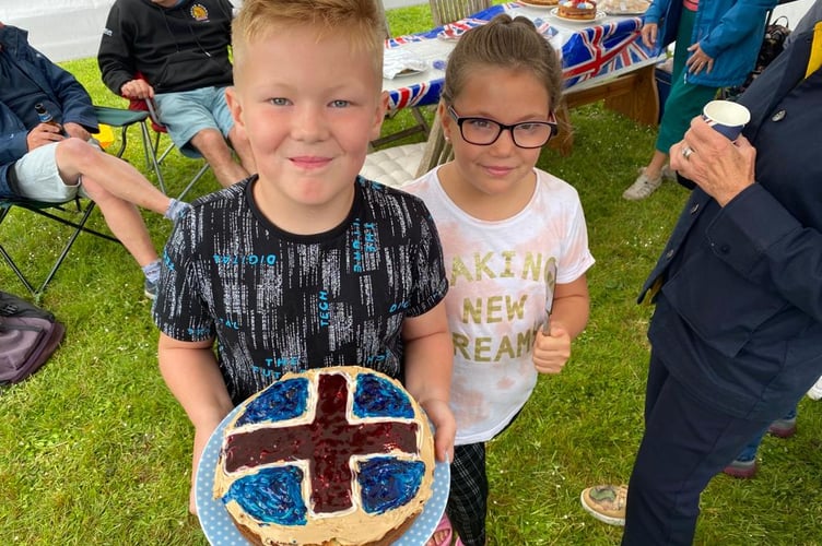 Diesel Mills with his cake at the Jubilee Party at Westernlea.