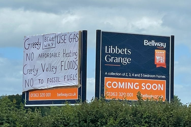 The banner placed on the Bellway Homes sign today, Sunday, June 12.  AQ 9585
