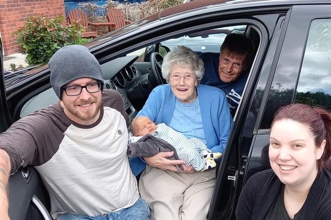 Cynthia Elston meets her seventh great grand child for the first time, here with his father, Danny, and grandfather Steve and Mum, Kaz. 
