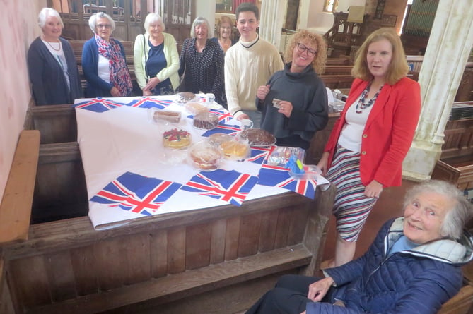 Around the table of cakes with the Union flag napkins, Val Pennington, left.  SR 2249
