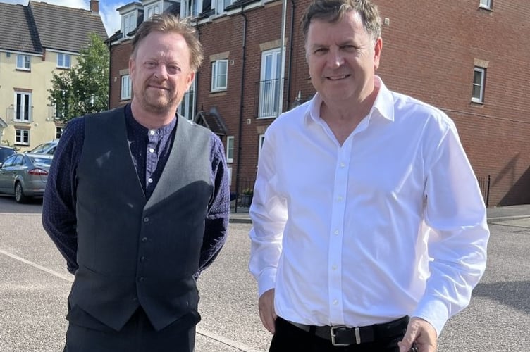 Mid Devon Councillor Stuart Penny discussing social housing in the district with Central Devon MP Mel Stride.

