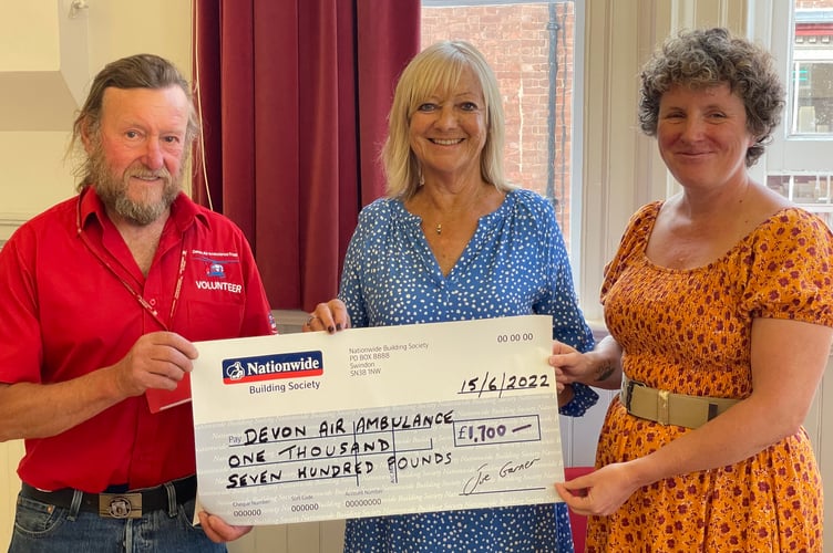 John Groves, left, receiving a cheque for £1,700 from CODS president Carolyn Stoyle, centre, and Heather Barlow, right.  AQ 9783
