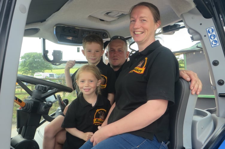 Peter and Sadie Bullock and their children Lochie (7) and Tiggy (4) fit in the tractor cab during the Open Farm Sunday event.  SR 2464
            
