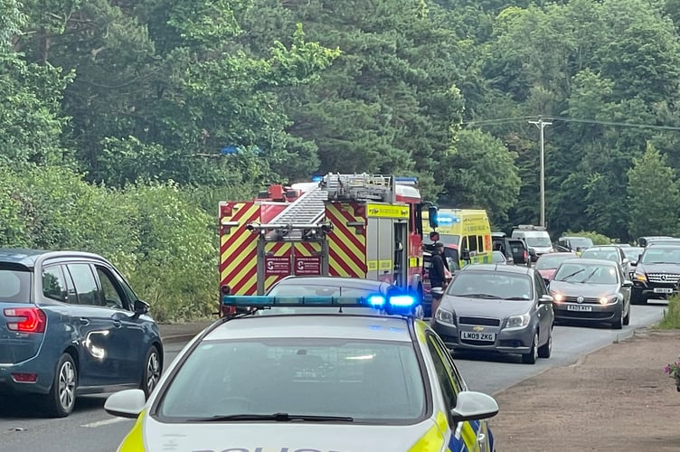 Traffic is able to pass the accident scene near Ladds corner.  AQ 0458
