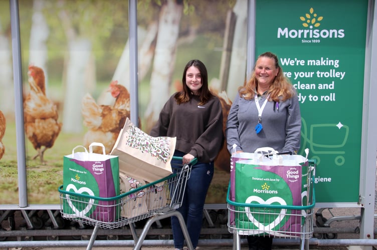 Renée Harvey, left, with the items she is taking to Kenya, thanks to Crediton Morrisons Community Champion, Mandy Fosbrooke. AQ 6973
