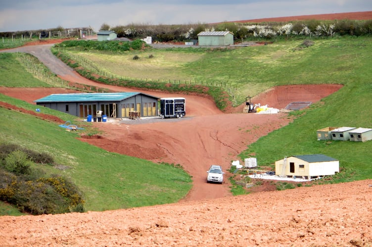 Centre is the mobile home which the parish council thought did not look like a mobile home, taken in April last year. SR 1362