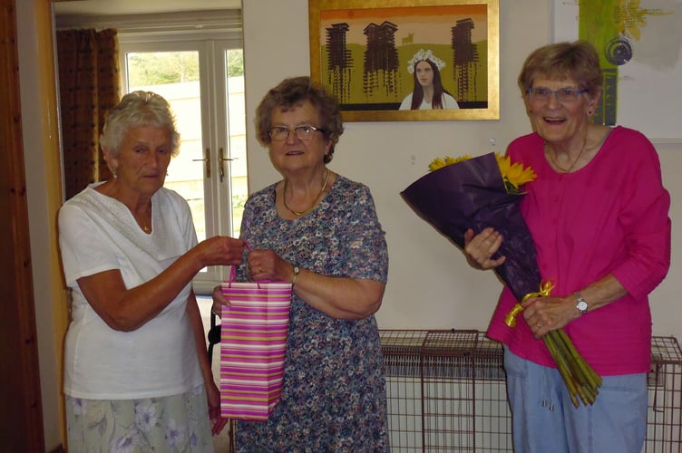 Brenda Fowler and Mary Nunn presented Jenny with gifts of wine and flowers.