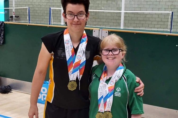 Dee Weiner, right, with her South West badminton doubles partner, Nikki Welch, wearing their gold medals.
