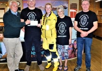 Crediton and District Swimming Club present £750 to RNLI