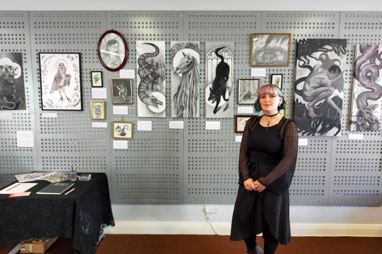 Katie Marland with some of her work at Crediton Library.