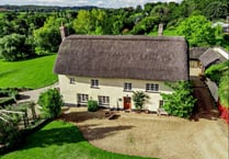 Farmhouse for sale sits on riverbank and has its own summer house 