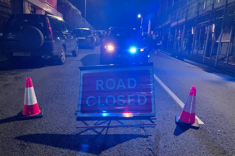 A road closure sign at the scene.