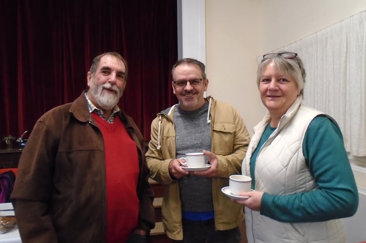 Peter Hawklsey of Newton St Cyres, having a cuppa at the Newton St Cyres Coffee morning in aid of the Newton Friends of the Arboretum Group, with Martin and Elaine Taylor, right.