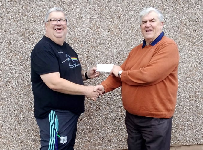 John Burrows, Chairman of LVCA, left, accepting a cheque for £300 from Worshipful Brother Peter Heal.