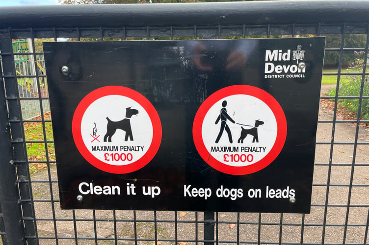 One of the dog fouling signs at the entrance to Newcombes Meadow in Crediton. AQ 7830