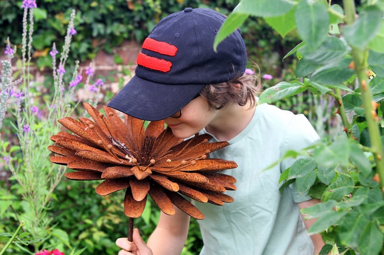Young-Aidan-taking-in-the-sights-and-smells-at-an-Open-Garden.jpg