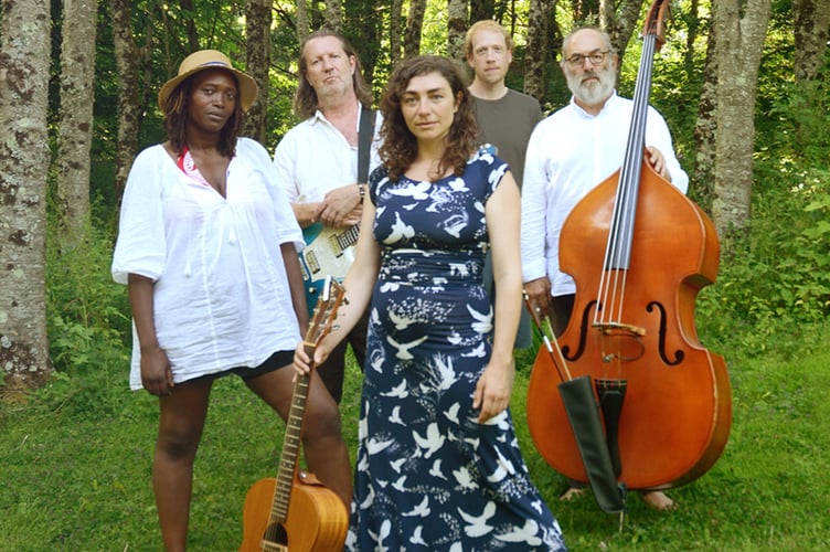 Holly Ebony with her band members who will appear at Crediton Arts Centre on December 2.
