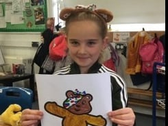 One of the children from Yeoford School with her Pudsey picture.
