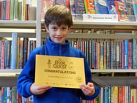 Frank receives certificate for reading 100 books