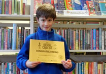 Frank receives certificate for reading 100 books