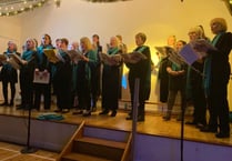 Villages Voices Choir donates £300 to Crediton Foodbank
