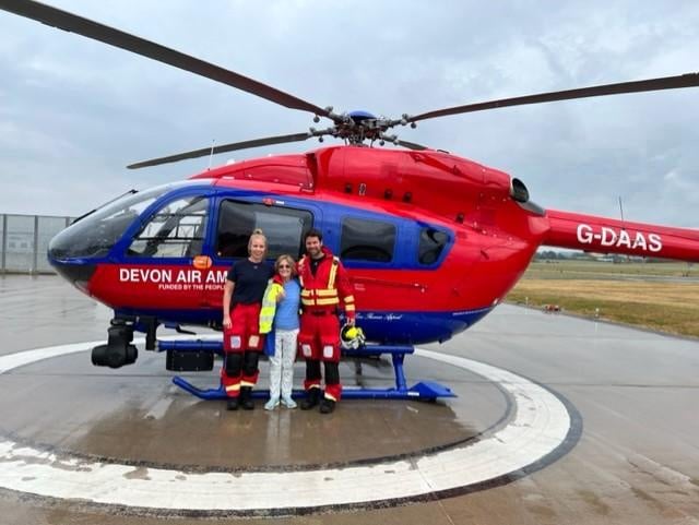 Devon Air Ambulance Specialist Paramedics, Jessica Thomas-Mourne and Lee Hilton with Ann Ralli, centre.
