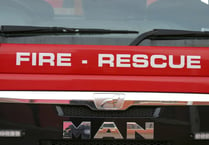 Fire crews cut out casualty from car on roof near Crediton
